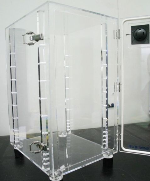Clear desiccator cabinet with its door open