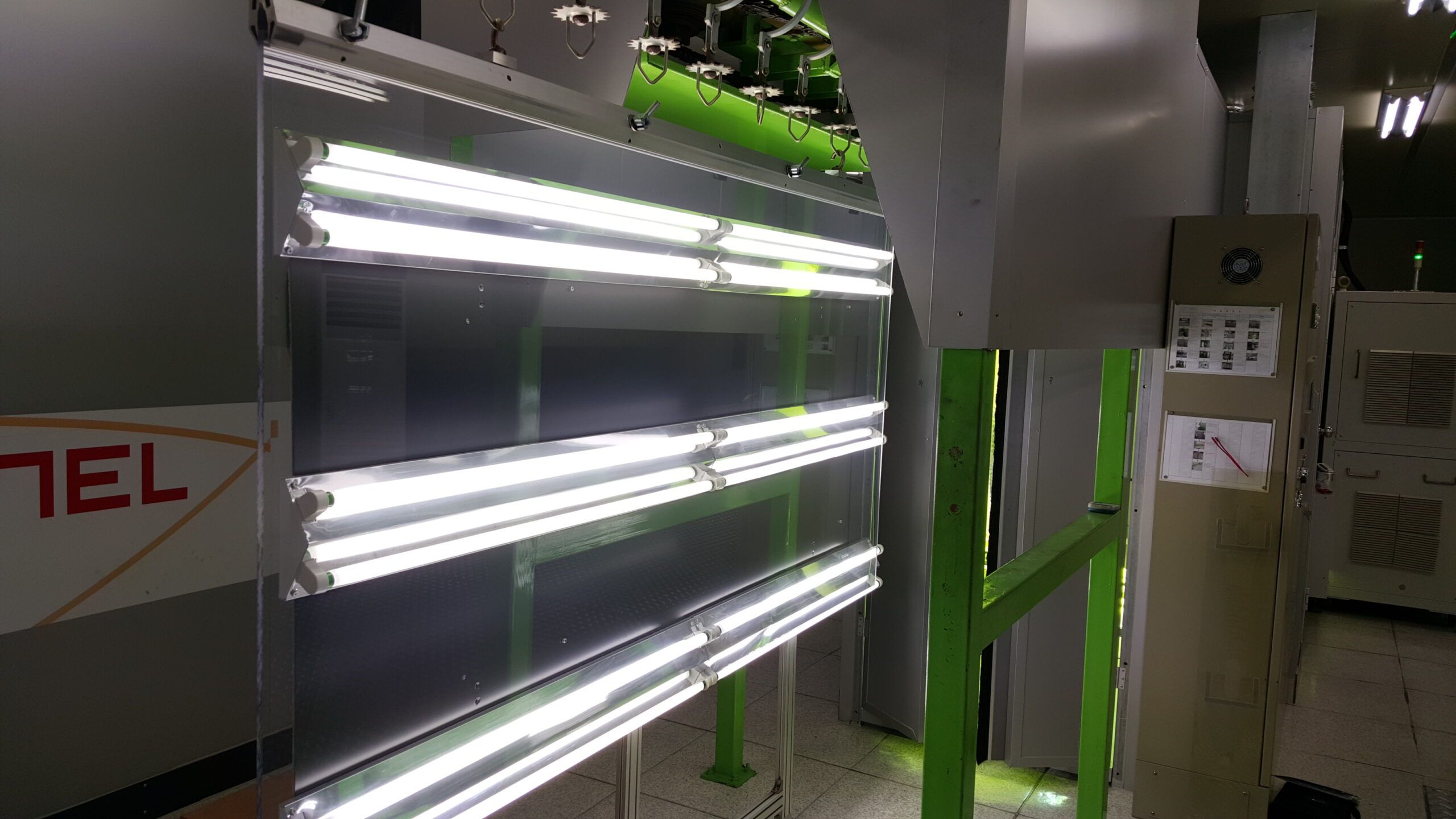Clear panel in front of lights inside the coating line